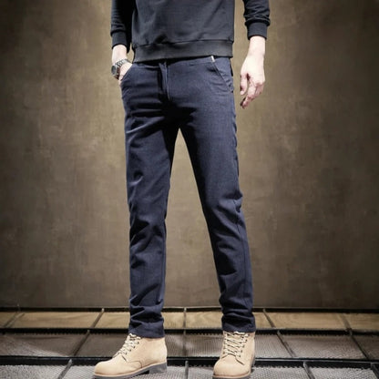 Man wearing modern slim fit tailored pants, demonstrating the sleek fit and comfort for any occasion.