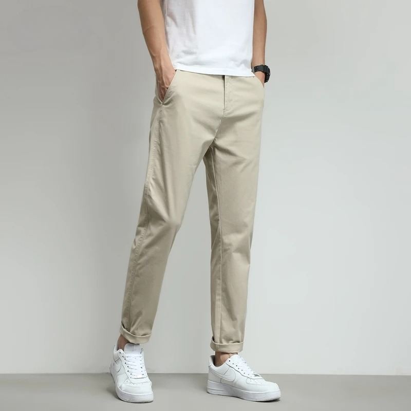 Navy slim-fit tech trousers for men, wrinkle-free & water-resistant.