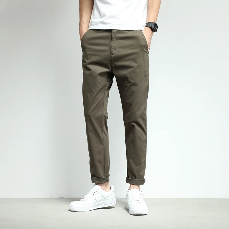 Modern men's travel pants, slim-fit, stretch, and easy care tech fabric.