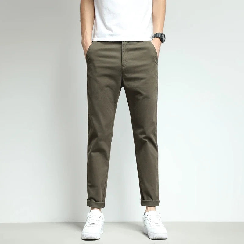 Gray slim-fit workwear trousers for men, featuring stretch & durability.