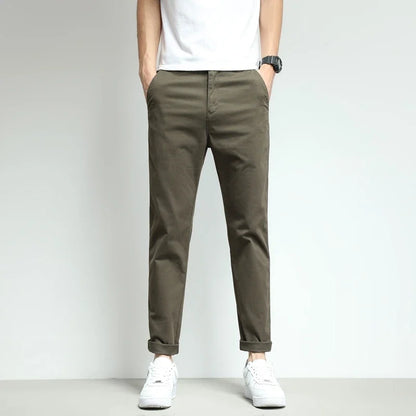 Gray slim-fit workwear trousers for men, featuring stretch & durability.