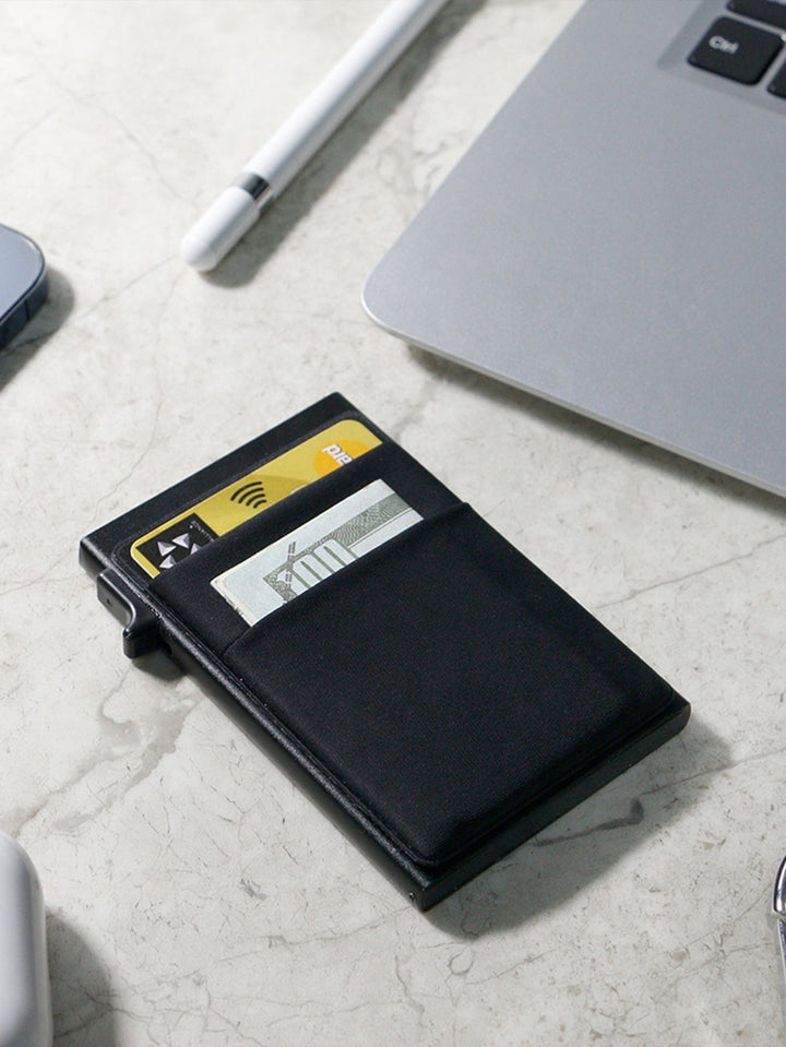 Elegant men's metal wallet, an ultra-slim RFID credit card holder for secure travel.