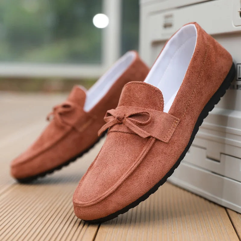 Classic men's loafers with a modern bow twist. Blends comfort, style, and versatility for daily wear.