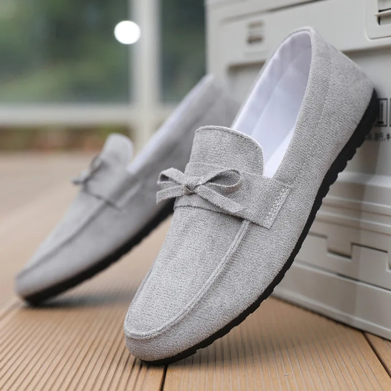 Premium men's comfort loafers with elegant bow detail. Perfect slip-on shoes for work or leisure.