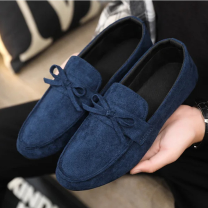 Comfortable slip-on men's shoes with bow detail. Ideal for daily wear, blending fashion & ease.