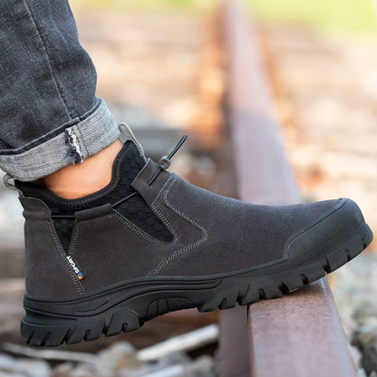 Brown men's slip-on steel-toe work boots, durable safety footwear for tough work environments.