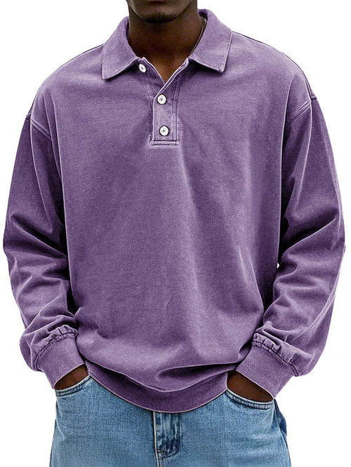 Detailed view of a men's smart-casual long-sleeve polo shirt, highlighting fabric and button placket.