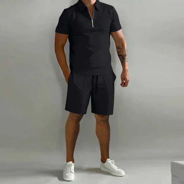 Men's sophisticated summer outfit with a casual polo shirt and matching shorts, perfect for comfort.