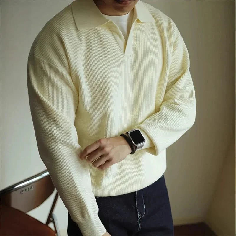 Man modeling a classic fit Men's Soft Knit Polo Shirt, showcasing its versatile and comfortable design.