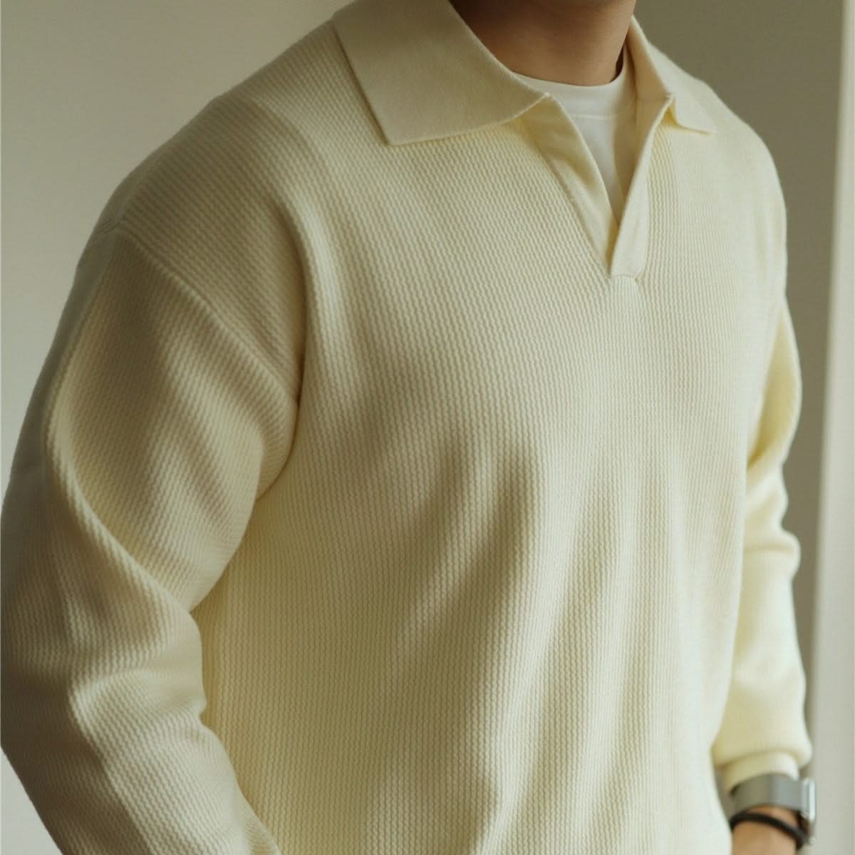 Upper body shot: Man wearing a breathable Men's Soft Knit Polo, emphasizing its soft fabric & comfort.