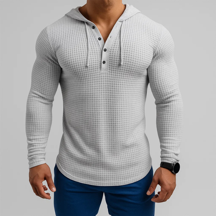 Close-up of a men's textured waffle hoodie, highlighting the comfortable knit for everyday wear.