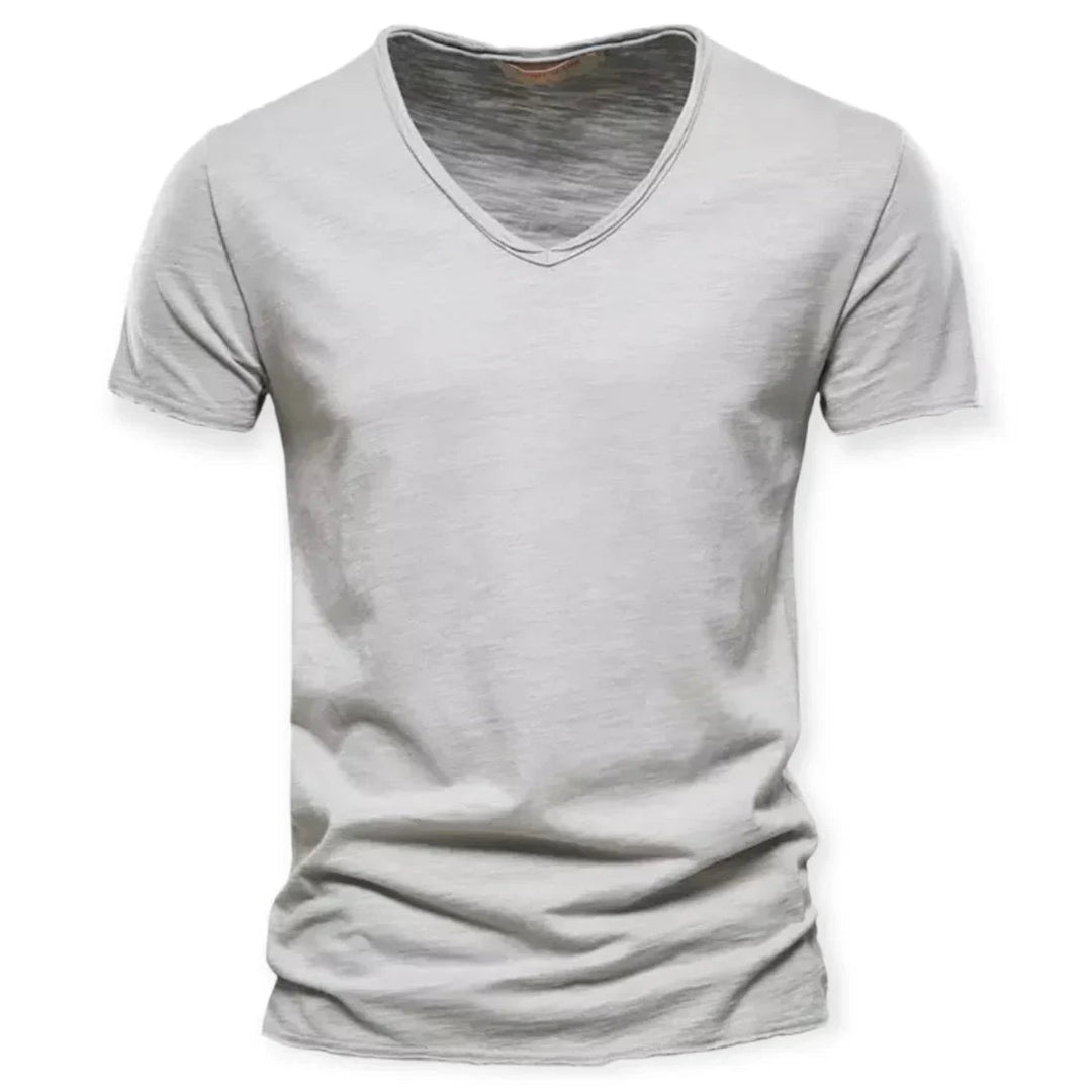 Men's V-neck t-shirt, showcasing its comfortable, breathable fit during casual movement. Versatile daily tee.