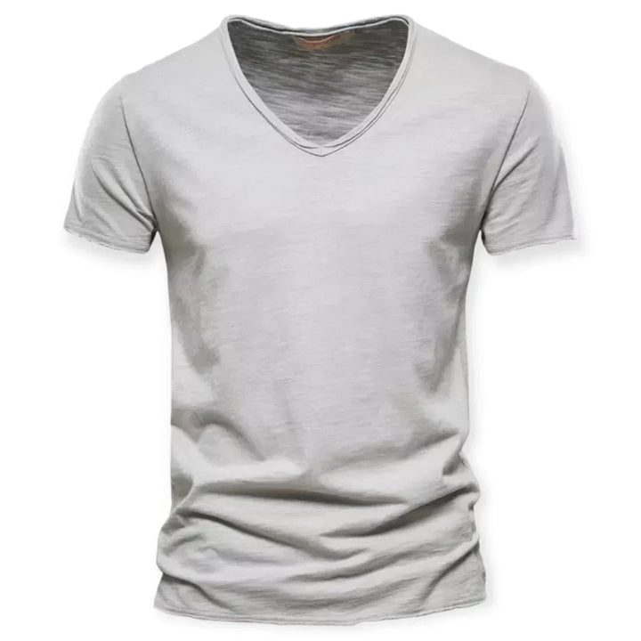 Men's V-neck t-shirt, showcasing its comfortable, breathable fit during casual movement. Versatile daily tee.