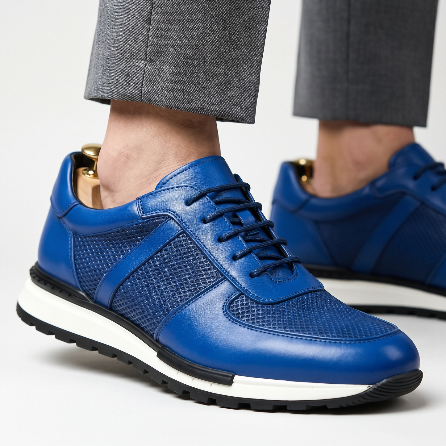 Side view of men's Spencer stylish leather mesh platform sneaker, comfortable casual footwear.