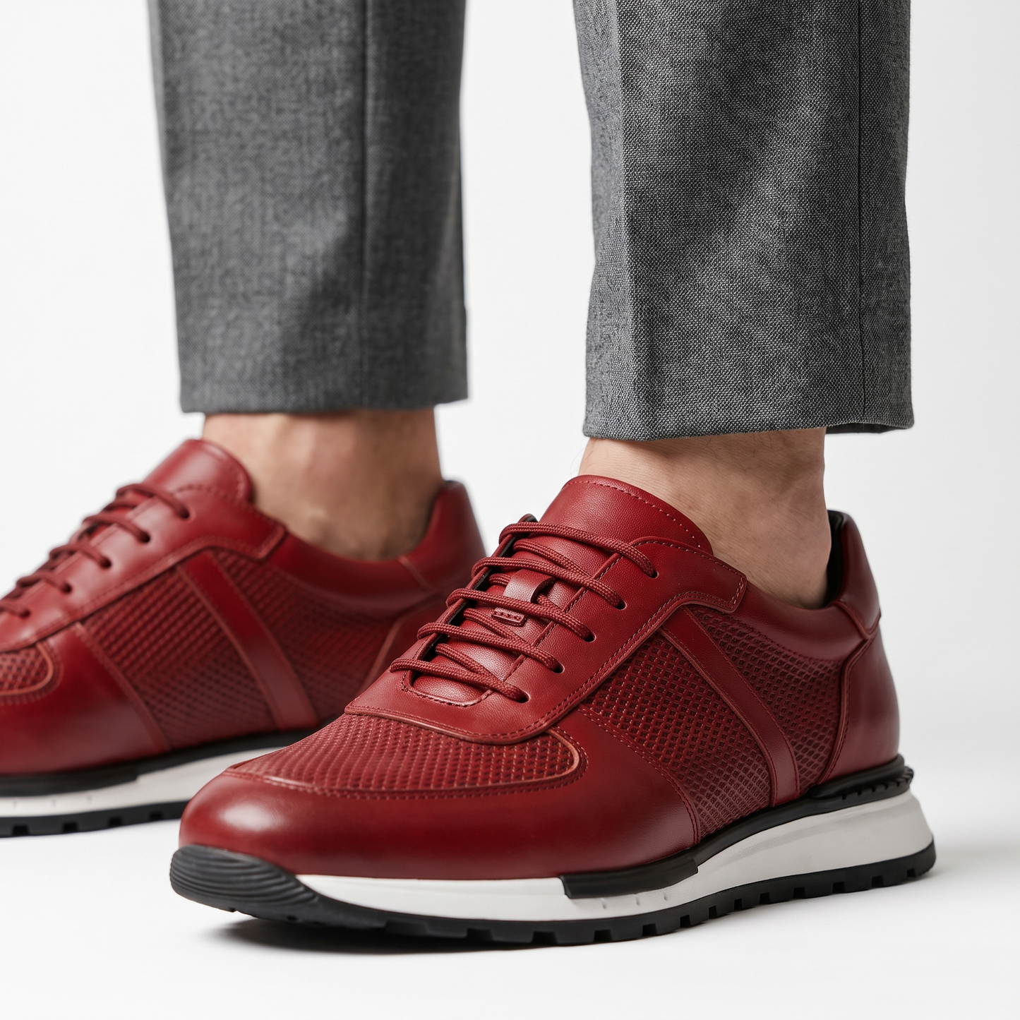 Close-up of men's Spencer leather mesh platform sneaker showing texture and lace-up details.