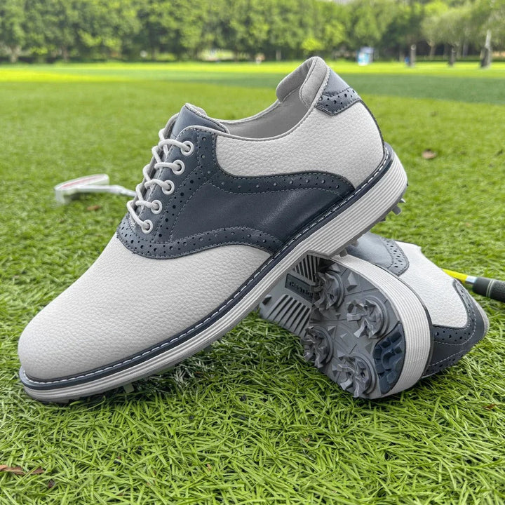 Men's classic brogue golf footwear with spikes. Water-resistant design for comfortable, athletic play.