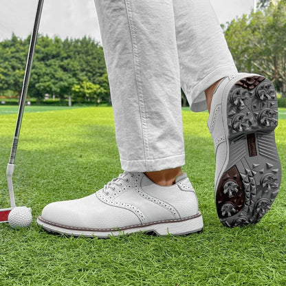 Close-up of men's spiked golf shoes, classic brogue pattern. Water-resistant for all-weather golf.