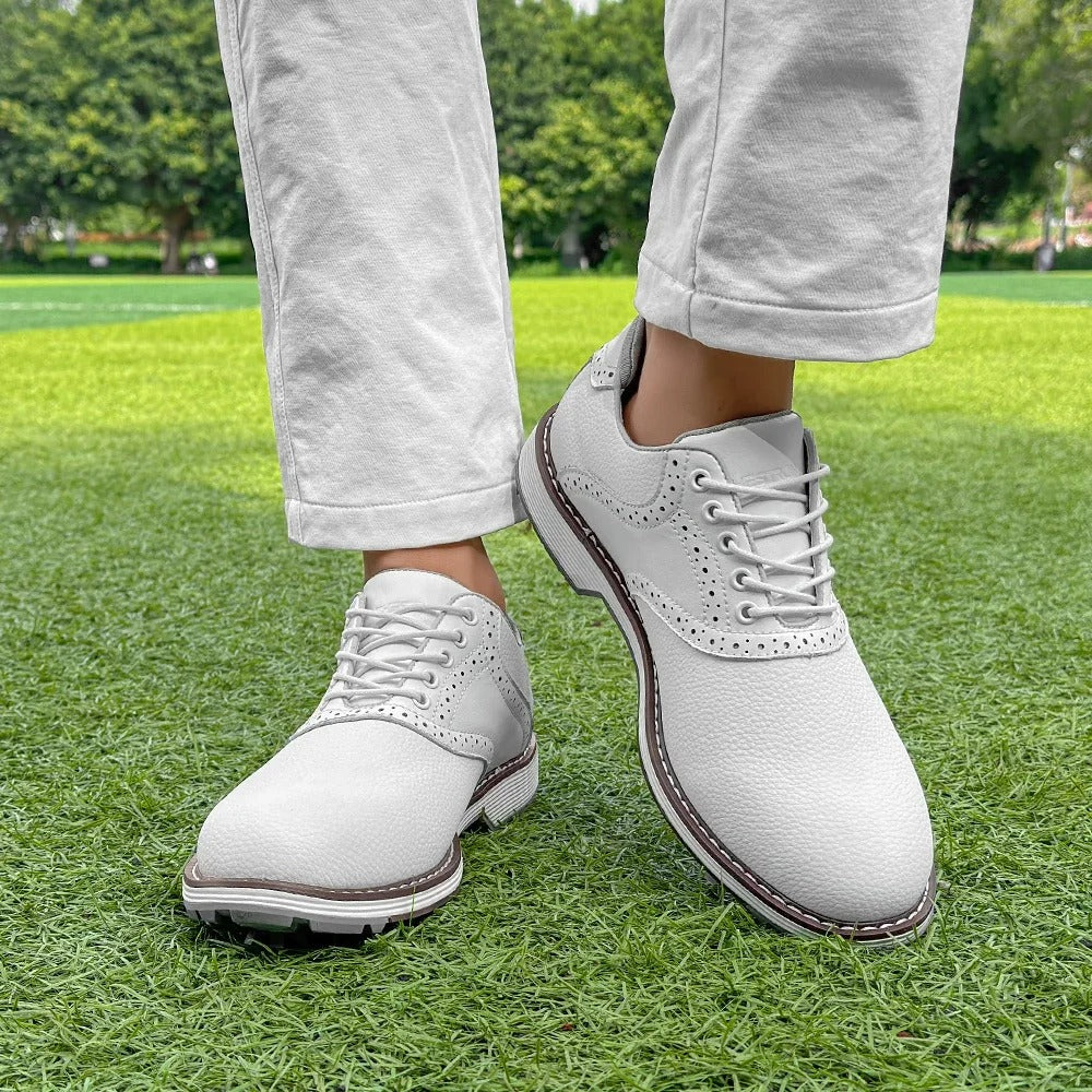 Side view of men's classic brogue spiked golf shoes. Water-resistant, comfortable performance golf footwear.