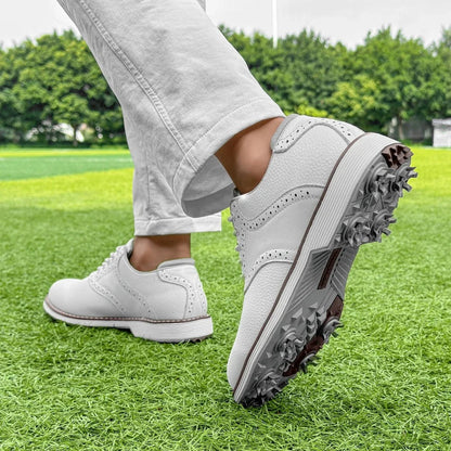 Durable men's spiked golf shoes, classic brogue style. Water-resistant for long-lasting golf performance.