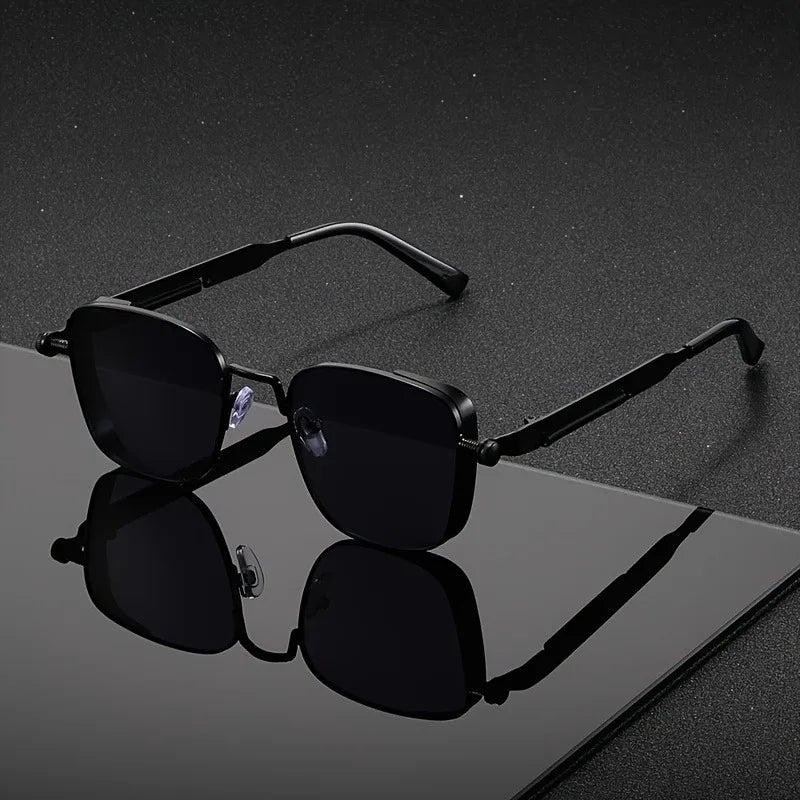 Black square frame men's sunglasses with UV400 protection. Anti-glare shades for a sleek, modern urban look.