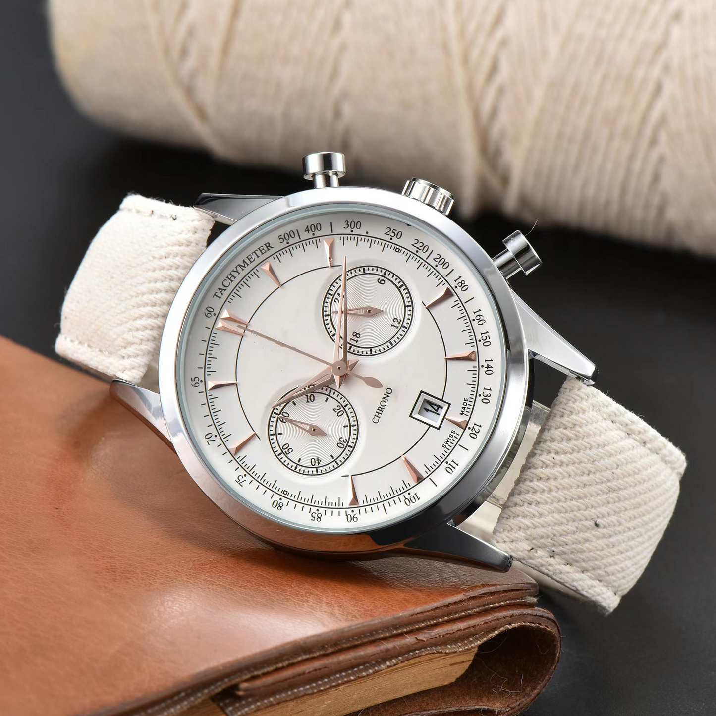 Modern men's chronograph watch featuring a durable stainless steel case and a comfortable canvas strap. Casual wrist accessory.