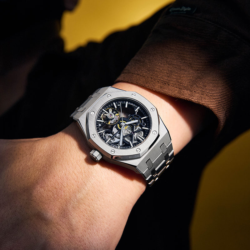 Men's stainless steel executive watch with sleek black dial, a luxury analog timepiece for formal occasions.
