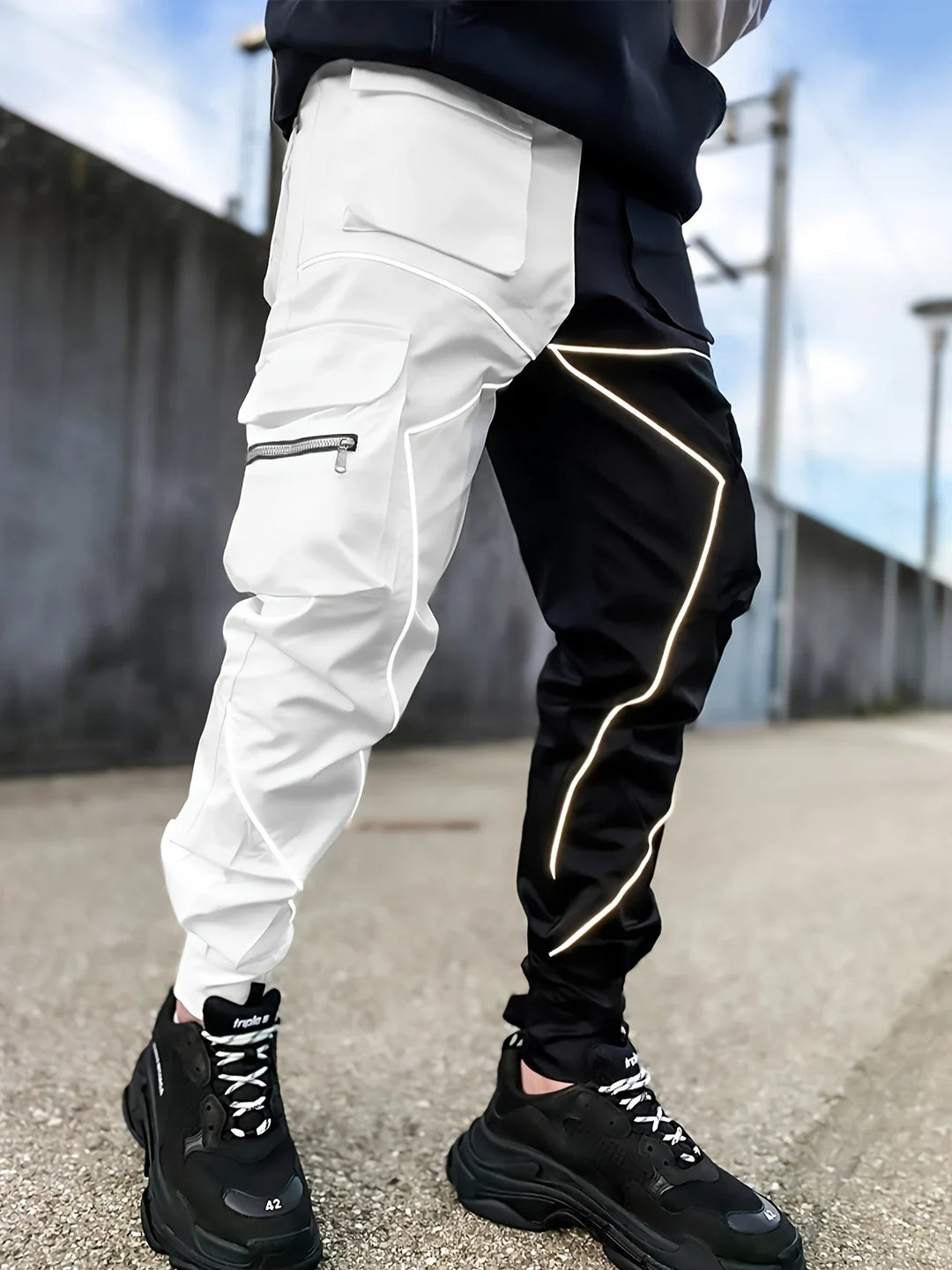 Stylish men's reflective cargo joggers with multiple pockets for functionality and modern appeal.