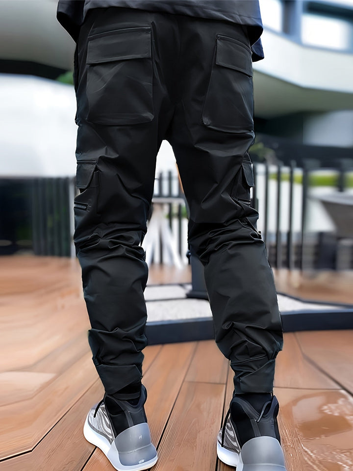Lightweight men's performance joggers with practical cargo pockets and water-resistant fabric.