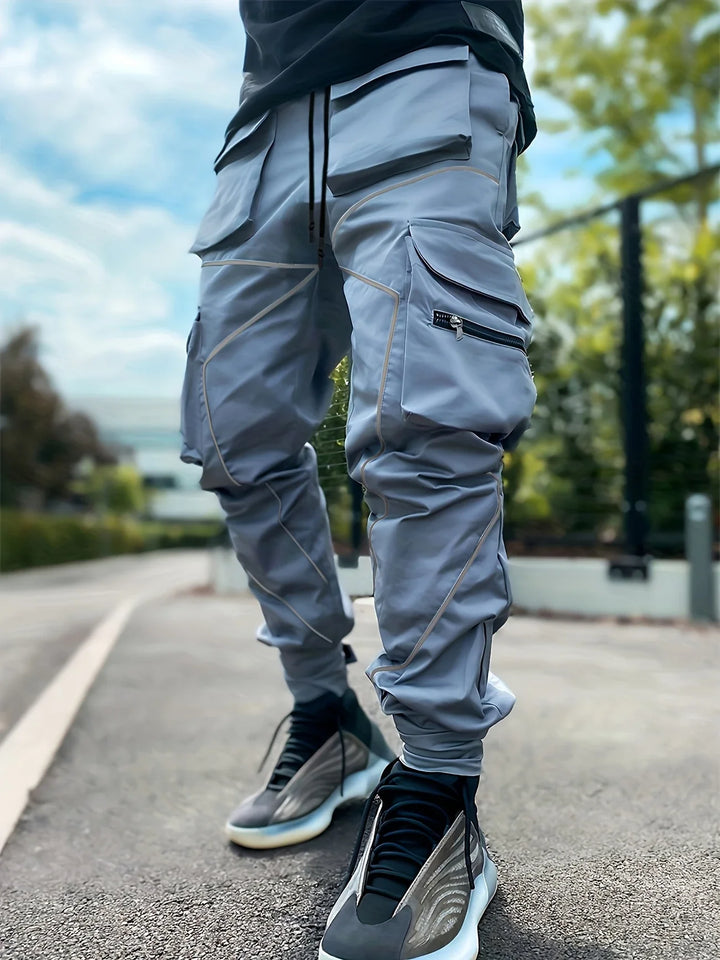 Water-resistant men's cargo joggers, featuring a stealth black design perfect for outdoor activewear.