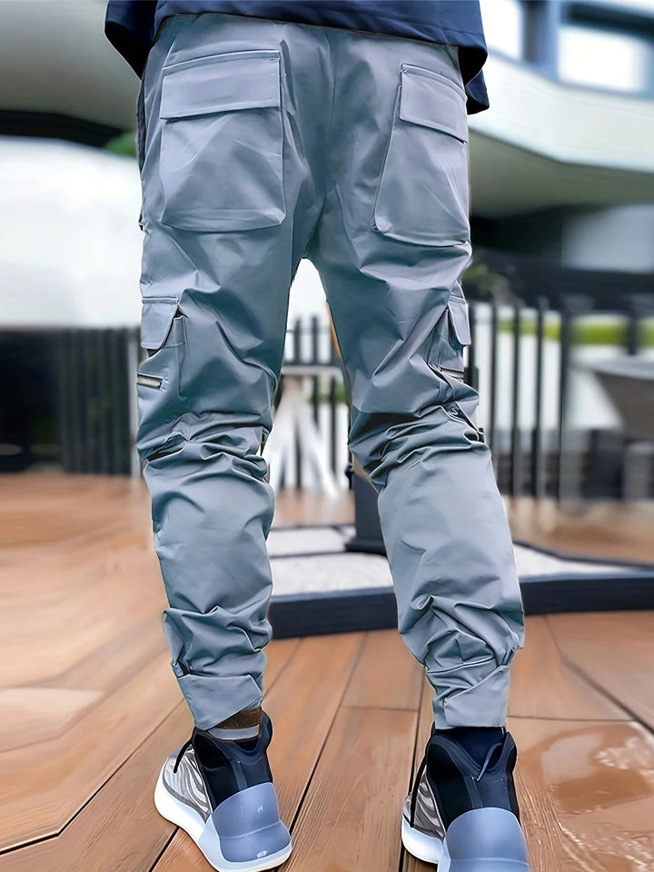Back view of men's stealth cargo joggers, highlighting durable, lightweight fabric & comfortable cut.