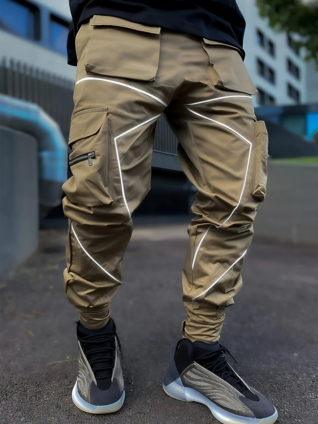 Side profile of versatile men's reflective joggers, combining athletic function with streetwear style.
