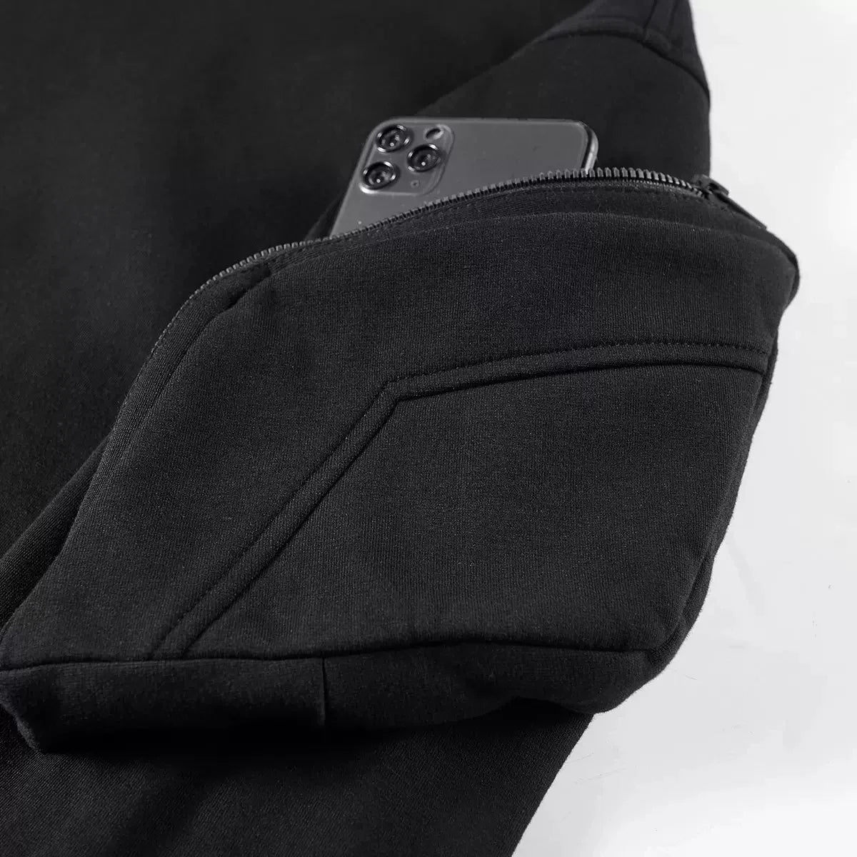 Men's full zip hoodie in stealth style, featuring a unique front shield and comfortable ribbed cuffs.