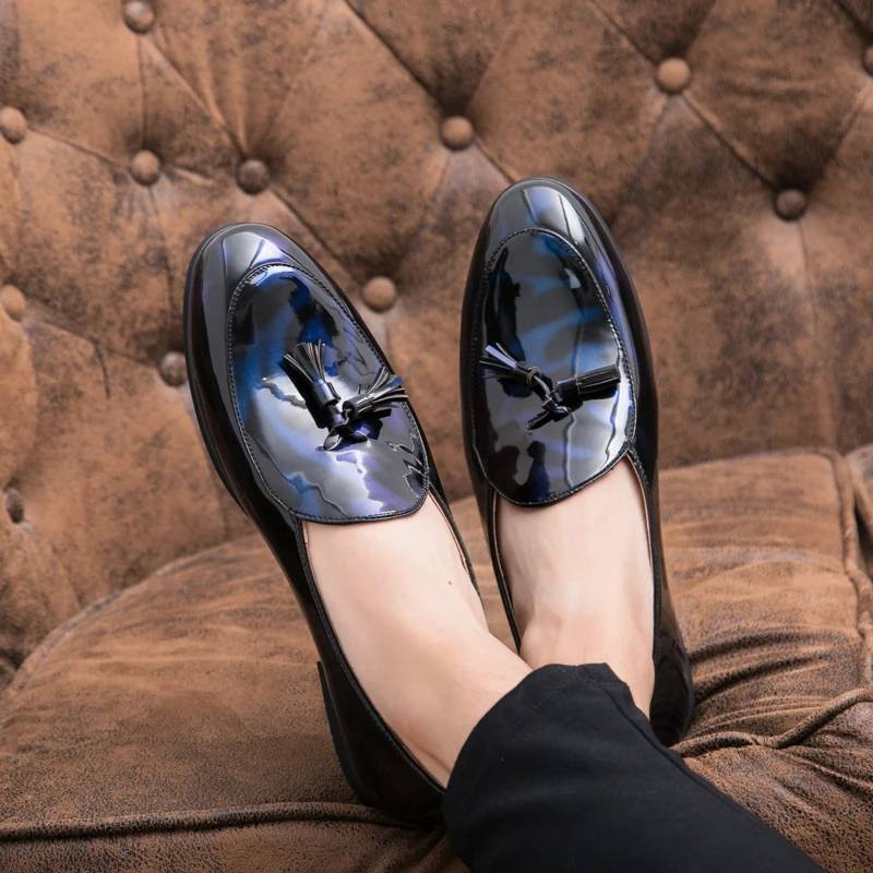 High-quality men's Sterling Midnight loafers, perfect dress shoes with sophisticated tassel detail.