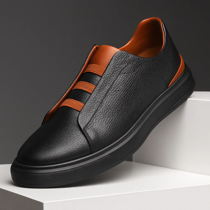 Black Men's Strada slip-on sneakers for versatile everyday wear. Comfortable laceless casual footwear for men.
