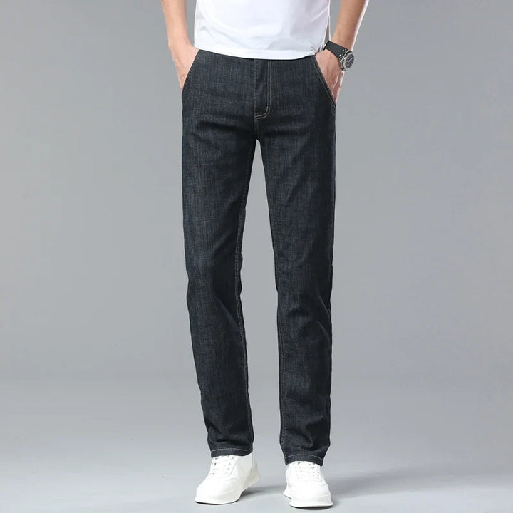 High-quality men's straight fit blue denim jeans, featuring a comfortable stretch fabric.