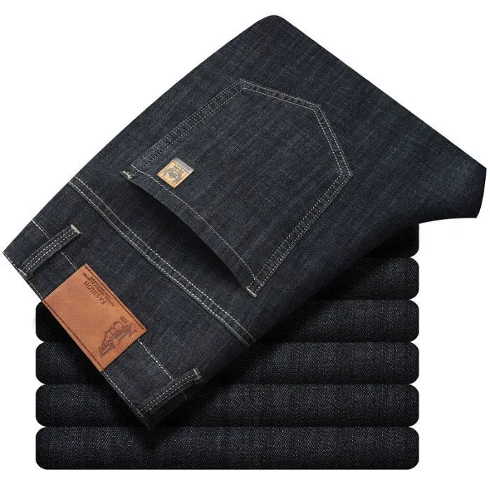 Men's straight fit denim jeans in a medium blue wash, offering stylish comfort for daily wear.