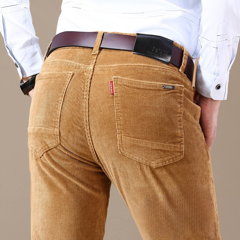 Close-up of soft cotton blend corduroy texture on men's stretch trousers, durable and comfortable fabric.