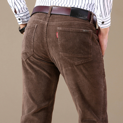 Man showcasing stretch & comfort of corduroy trousers, ideal men's casual pants for all-day wear.