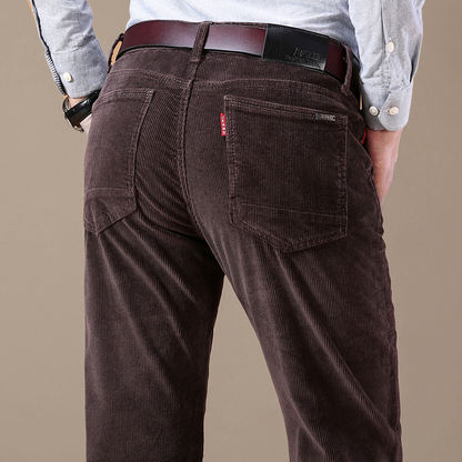 Close-up of waistband and button closure on men's stretch corduroy trousers, quality men's apparel.
