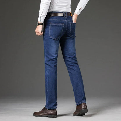 Wrinkle-resistant men's stretch straight leg denim jeans, offering comfort and classic straight fit.