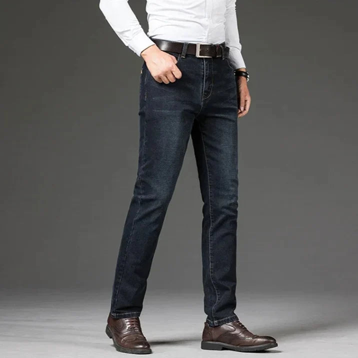 Detailed shot of men's straight leg denim jeans, highlighting the soft, stretch denim fabric.