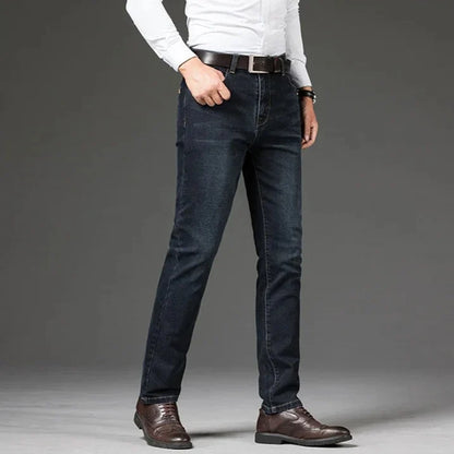 Detailed shot of men's straight leg denim jeans, highlighting the soft, stretch denim fabric.