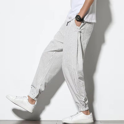 Modern men's striped athletic pants, Japanese-inspired comfort for active days or relaxed evenings.