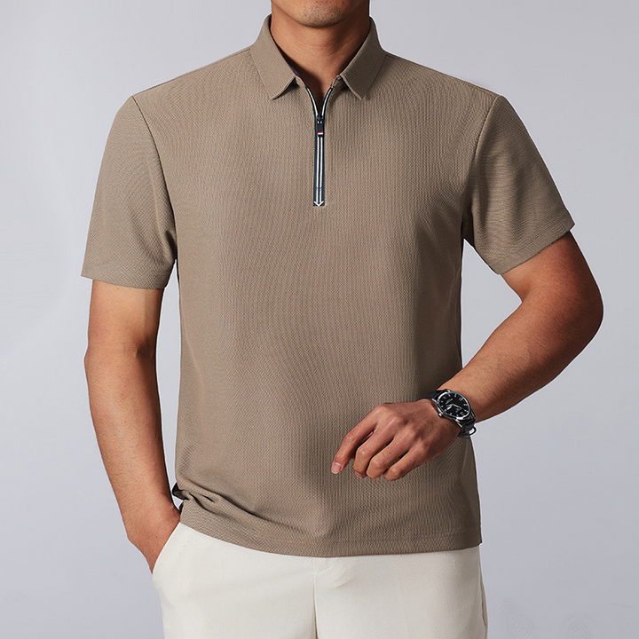 Men's sophisticated cotton blend quarter-zip polo shirt with a structured feel and tailored fit.