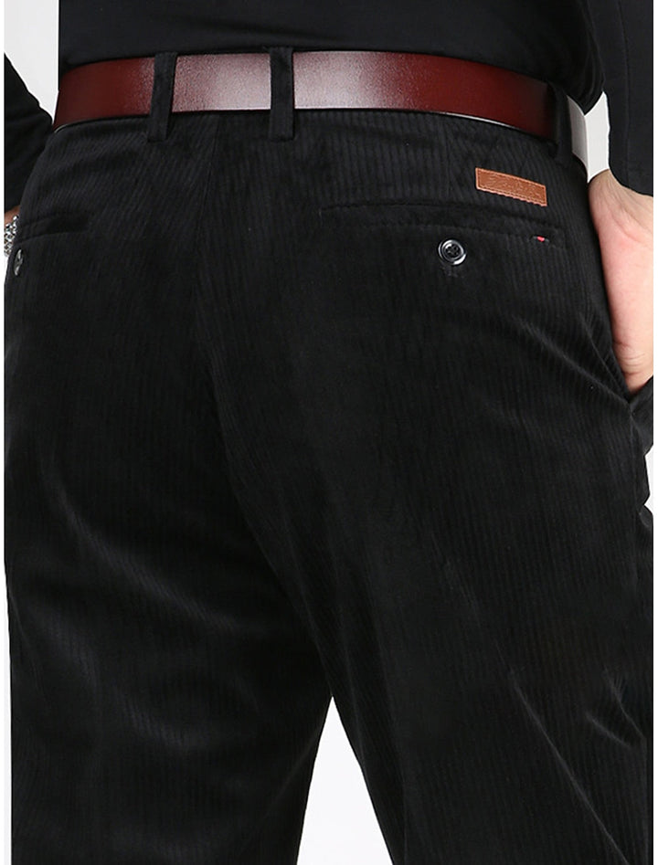Close-up of men's structured ribbed trousers fabric, showing textured pattern and quality for modern comfort.