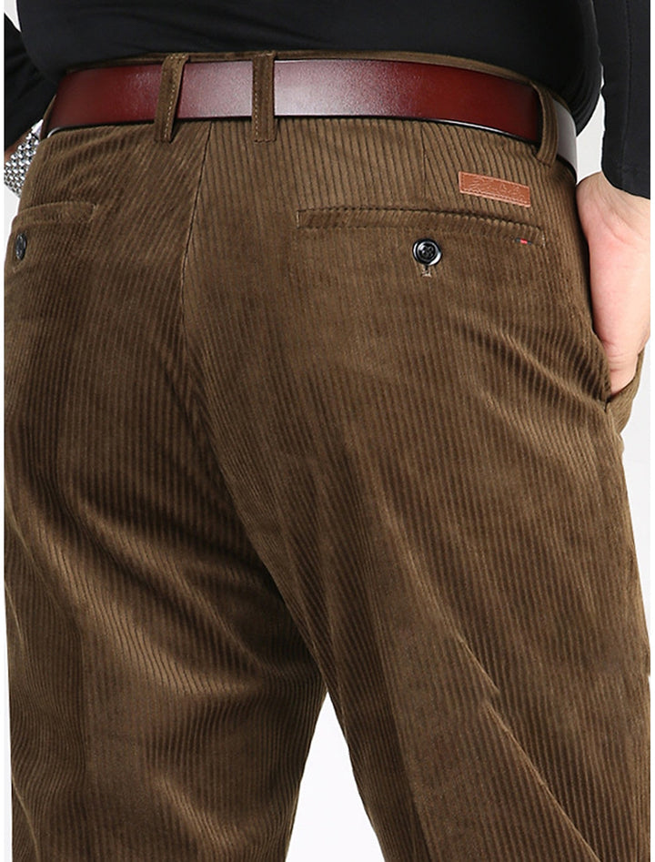 Man wearing modern fit men's ribbed pants, styled for versatile smart casual & comfortable everyday fashion.