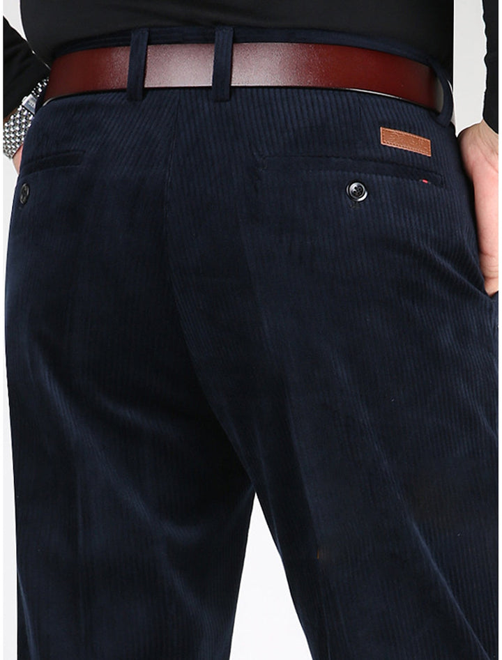 Back view of men's structured ribbed pants, showcasing sleek modern fit, comfort & practical utility pockets.