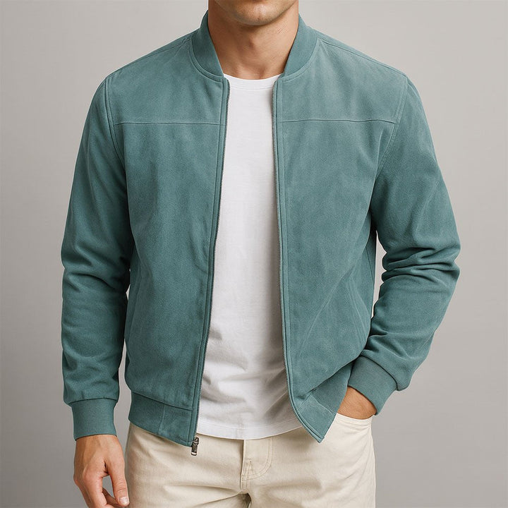 Stylish man wearing a versatile tailored bomber jacket, perfect for smart casual, refined trans-seasonal look.