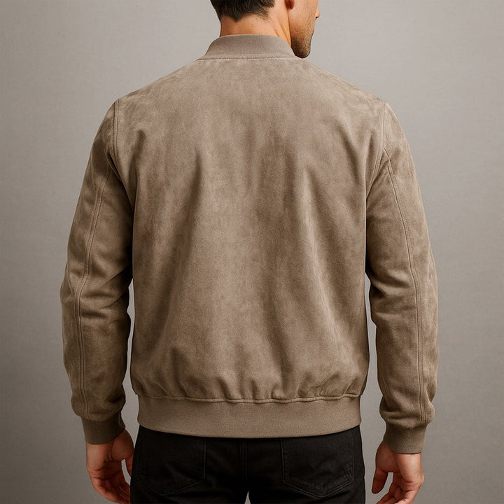 Detail of a structured men's tailored bomber jacket, refined collar & cuffs, versatile trans-seasonal outerwear.
