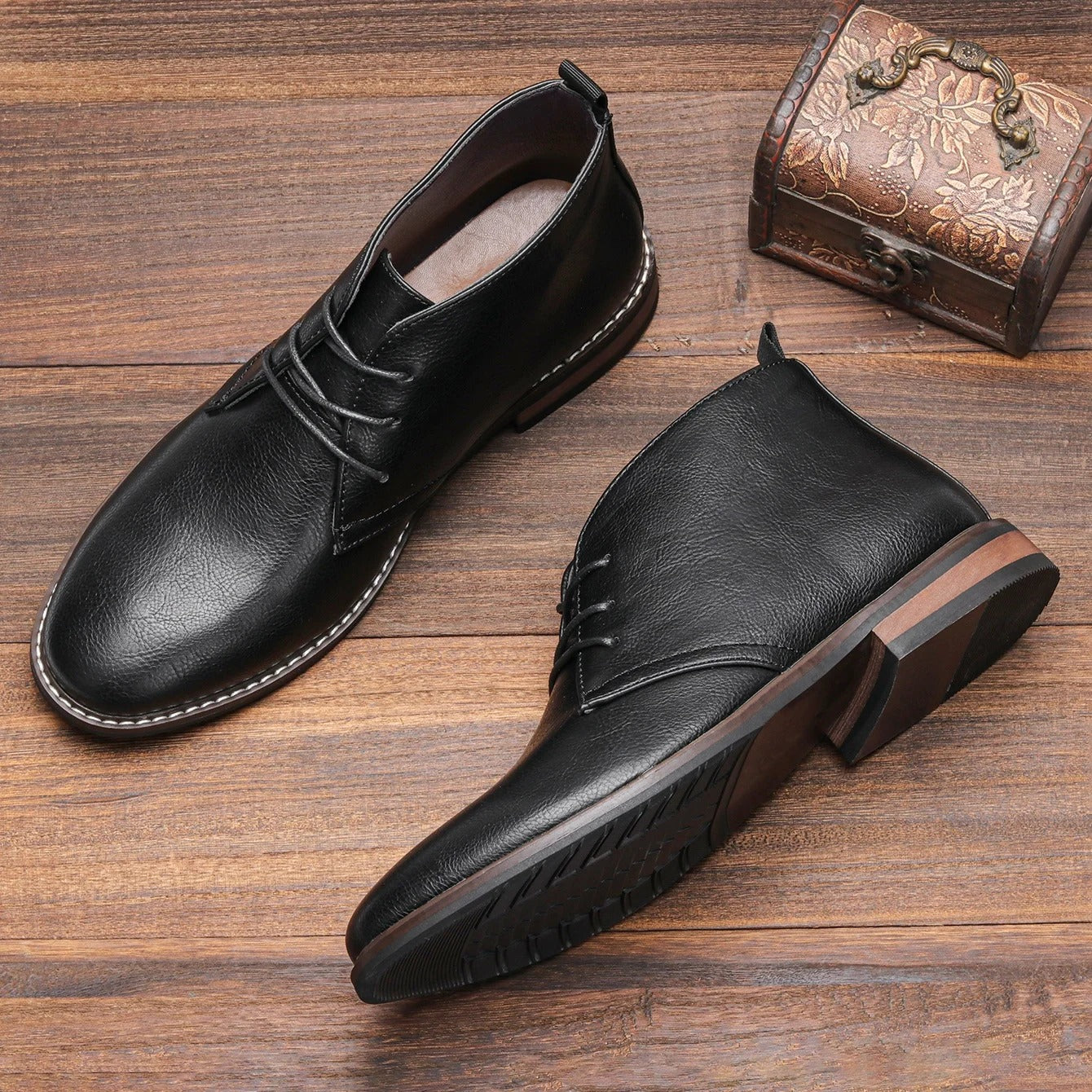 Comfortable black leather chukka boots for men, perfect for a casual yet stylish look.